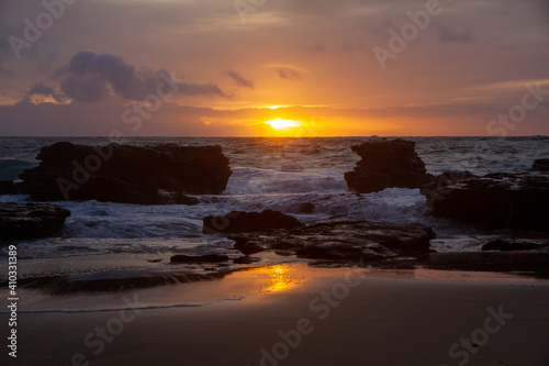 Epic colorful Sunrise over Sandy Beach, a beach on the South Shore of Oahu in Hawaii 