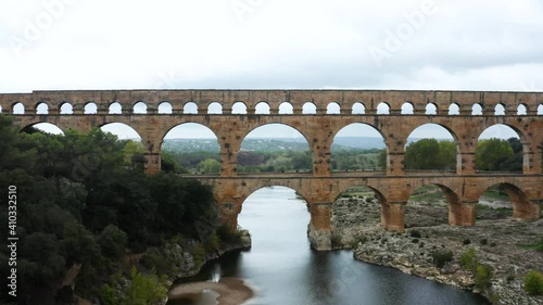 Flight through ancient Pont du Gard aqueduct in France