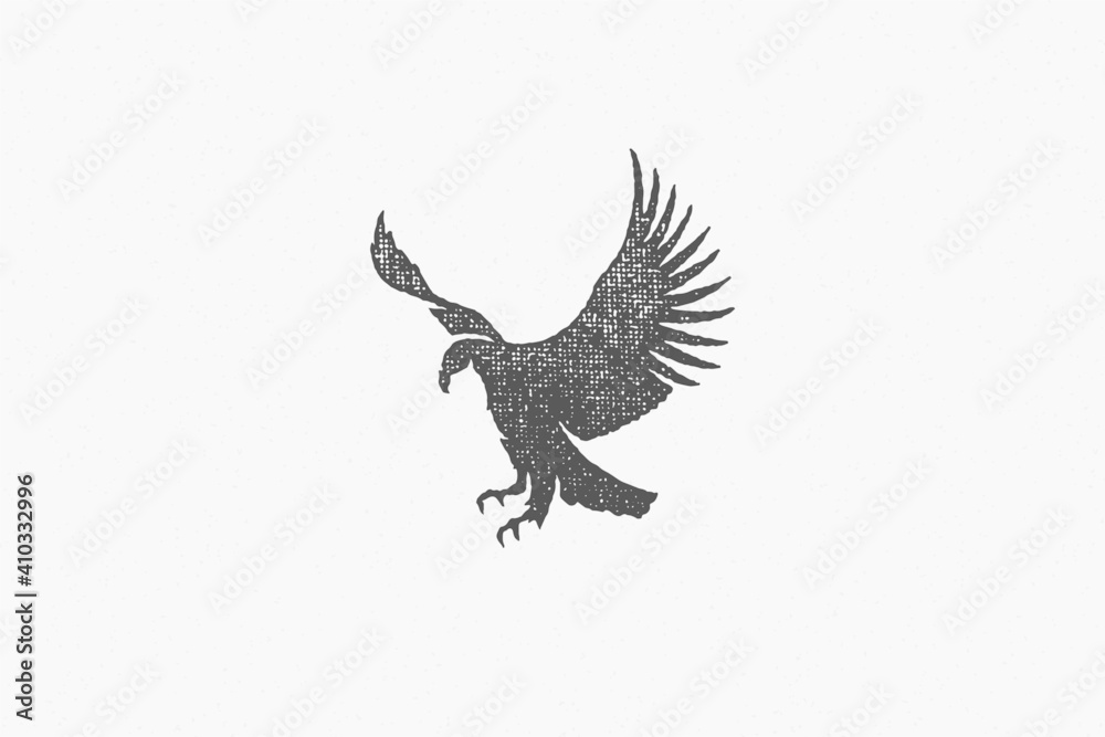 Obraz premium Black silhouette wild eagle soaring in sky in countryside hand drawn stamp effect vector illustration.