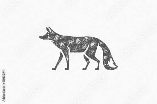 Black silhouette of wild fox walking as symbol of wildlife in countryside hand drawn stamp effect vector illustration