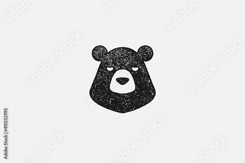 Black silhouette of head wild bear as countryside exploration symbol hand drawn stamp effect vector illustration.