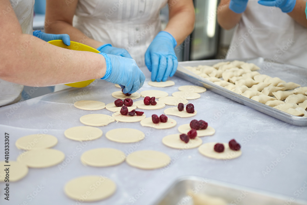 Hand molding of cherry dumplings. Homemade food. Hand molding of cherry dumplings. Homemade food.