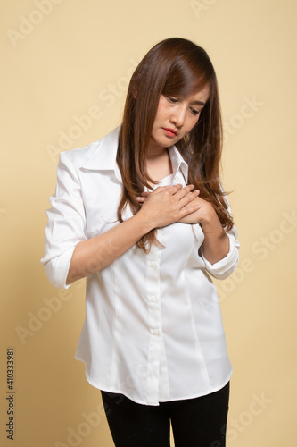Young Asian woman got chest pain.