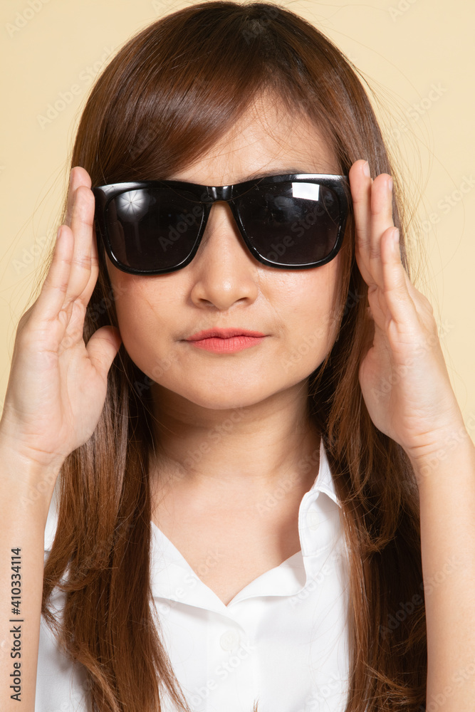 Portrait of a beautiful young asian girl in sunglasses. Portrait of a beautiful young asian girl in sunglasses.