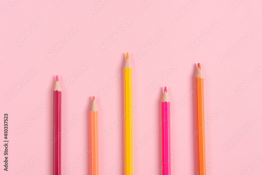 Close up macro shot of color pencil on pink background Close up macro shot of color pencil on pink background