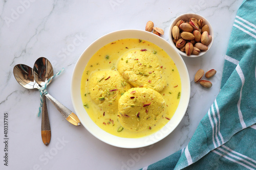 Rasmalai, Rossomalai, Roshmolai, Rasamalei is a very popular Indian dessert. It's a Similar dish to Rasgulla. It is a sweet delicacy made with Indian cottage cheese or chenna. Copy space.