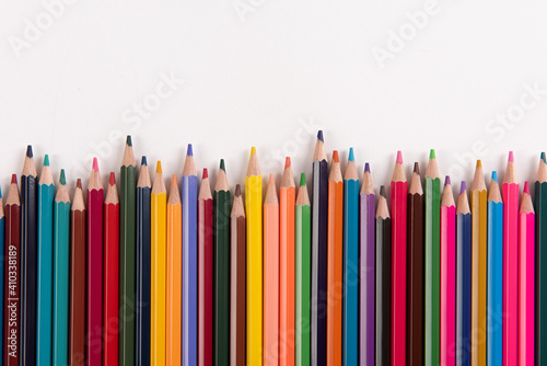 Color pencils array isolated on white background