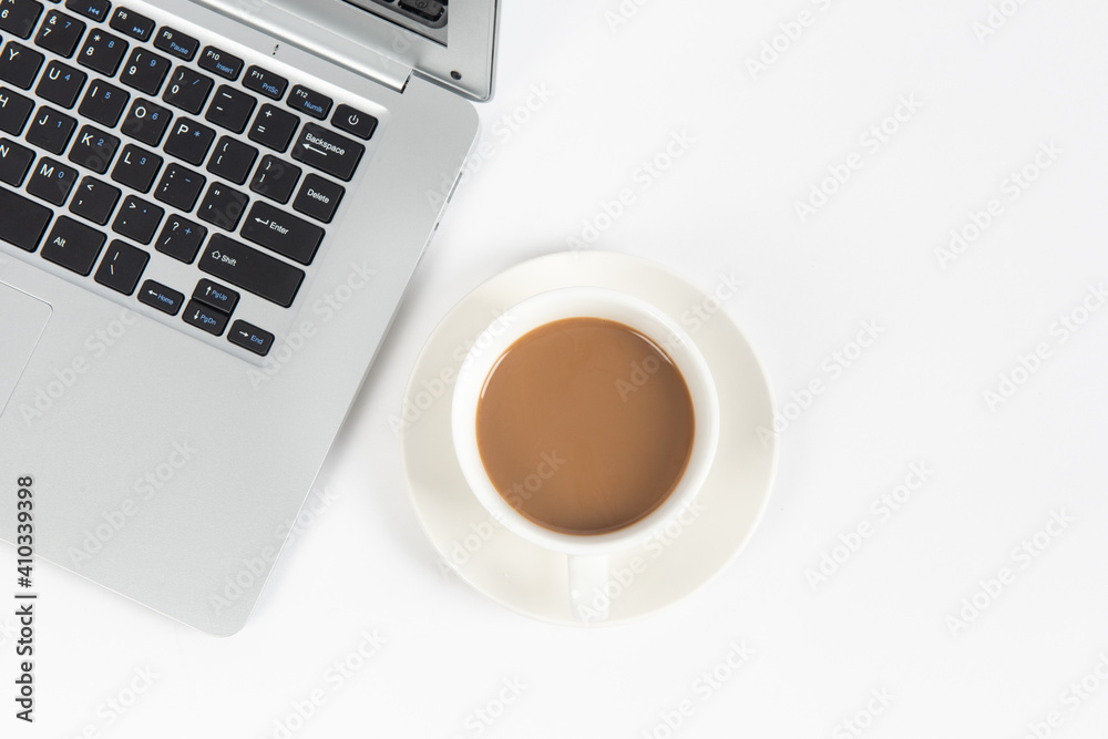 White office desk table with laptop computer, cup of coffee. Top view with copy space, flat lay. White office desk table with laptop computer, cup of coffee. Top view with copy space, flat lay.