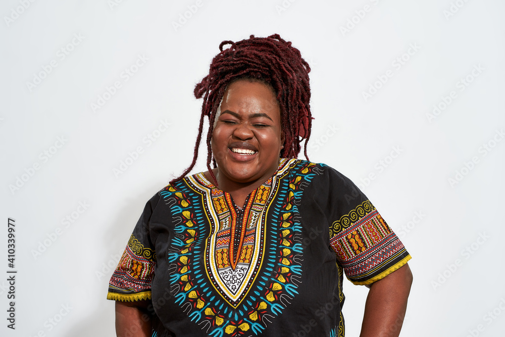 Portrait of happy plump young woman lauging