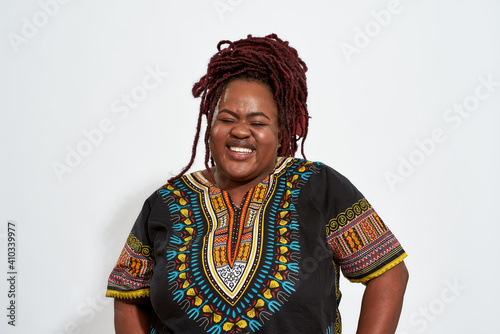 Canvas Print Portrait of happy plump young woman lauging