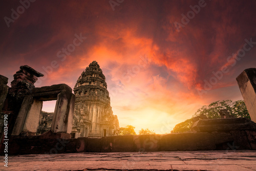 Selective focus on Phimai Historical Park with sunset sky. Landmark of Nakhon Ratchasima, Thailand. Travel destinations. Historic site is ancient. Ancient building. Khmer temple classical architecture photo
