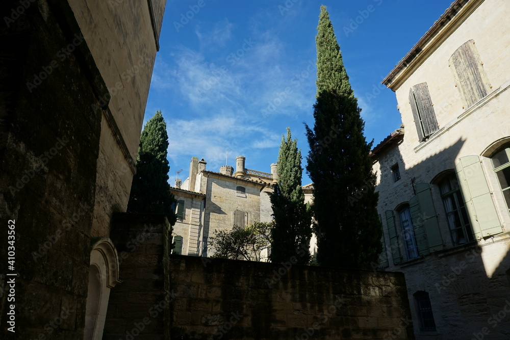 some houses and cypresses in Uzes, Occitanie, France, November