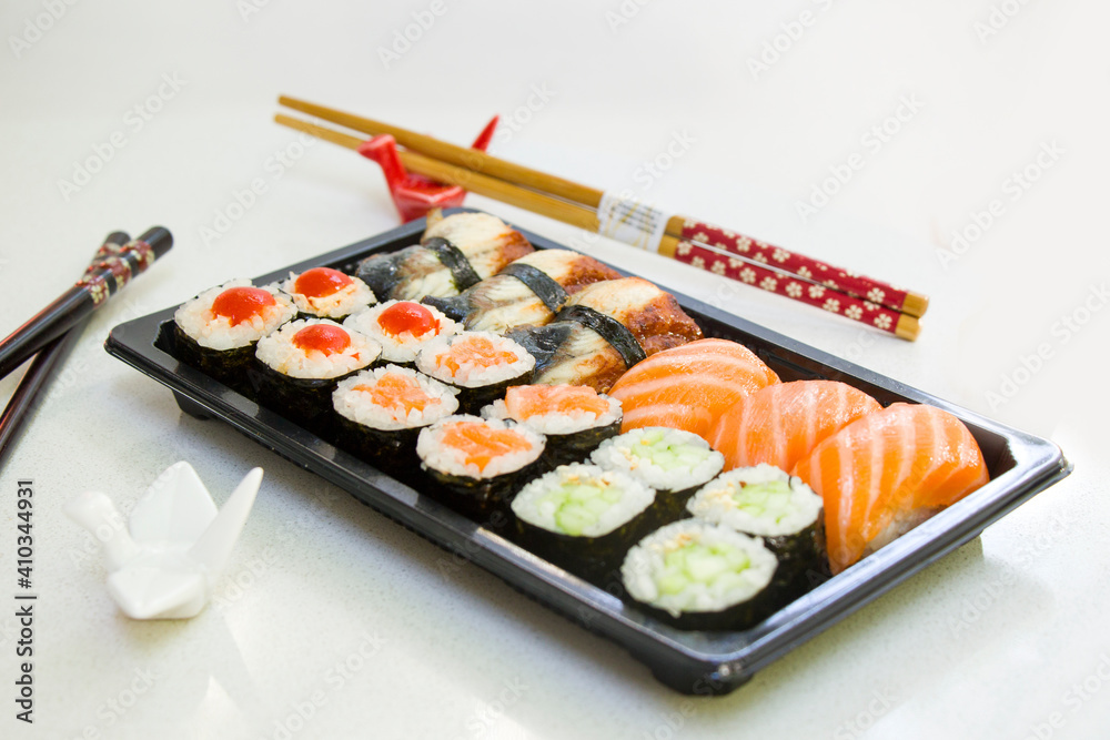 California an eel fish sushi rolls set on the stone plate, sushi delivery set California an eel fish sushi rolls set on the stone plate, sushi delivery set