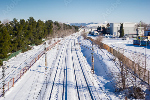 Snowy train tracks in Coslada on a cold winter's day.