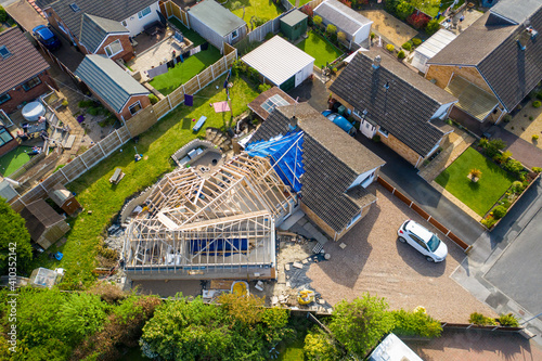 Aerial photo of a typical british housing esate in the Village of Kippax in Leeds West Yorkshire, suburban housing estates and road in the village showing an extension being built on a property photo