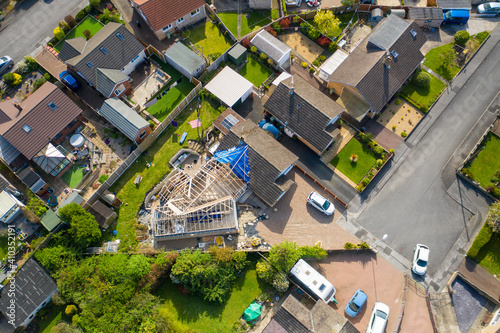 Aerial photo of a typical british housing esate in the Village of Kippax in Leeds West Yorkshire, suburban housing estates and road in the village showing an extension being built on a property photo