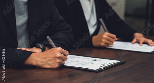 Business people fill resume application information on the desk, presents the ability for the company to agree with the position of the job.