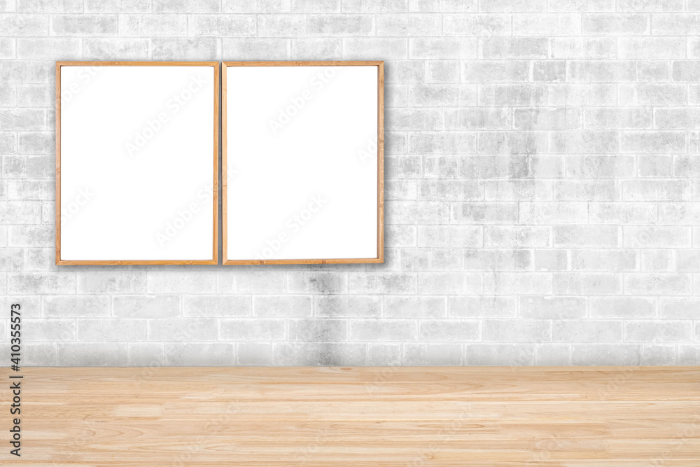 2 brown blank wooden frames for pictures and art for a modern home decoration on a brick wall. 2 brown blank wooden frames for pictures and art for a modern home decoration on a brick wall.