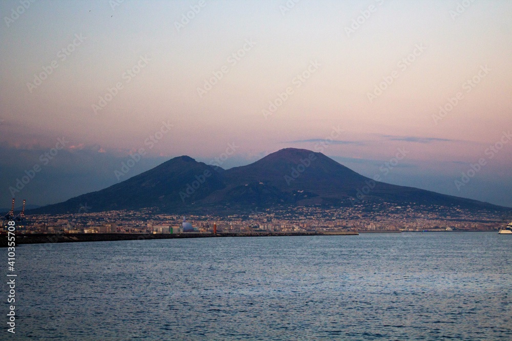 Naples, Italy, June 26, 2020 evocative image of Vesuvius seen from the city at sunset 