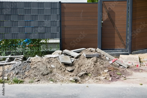Illegal dumped debris in the front of the residential area