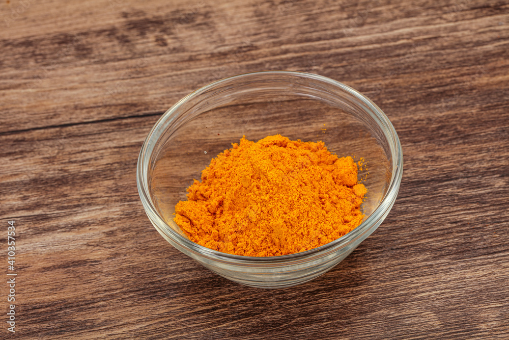 Tumeric powder in the bowl Tumeric powder in the bowl
