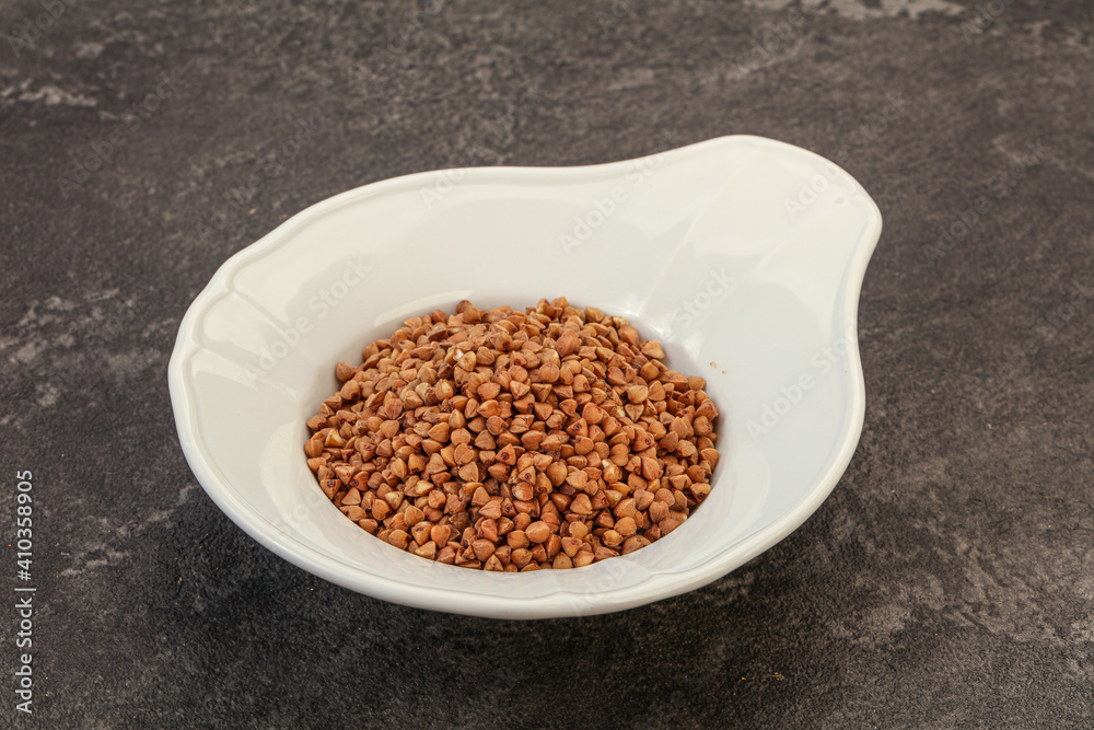 Raw buсkwheat cereal in the bowl Raw buсkwheat cereal in the bowl
