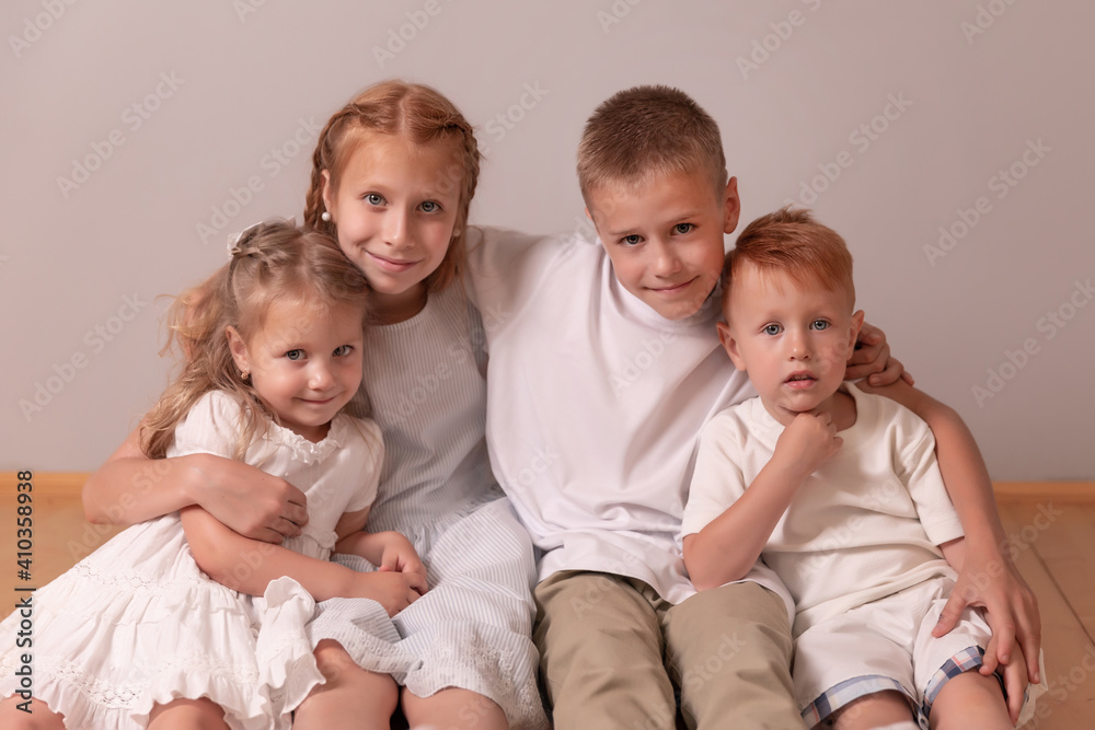 brothers and sisters. children hug. 4 children. large family brothers and sisters. children hug. 4 children. large family