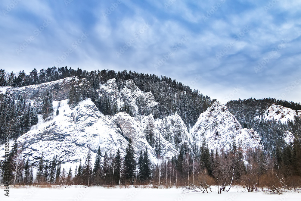 Winter landscape, rocks and forest, Siberia, Mana river. Hike