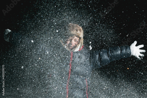 A picture in the evening of a girl in snowy frosty weather