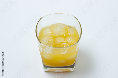 Wallpaper Mural Juice with ice in a glass on a white background. Natural mango juice. Refreshing drink Torontodigital.ca