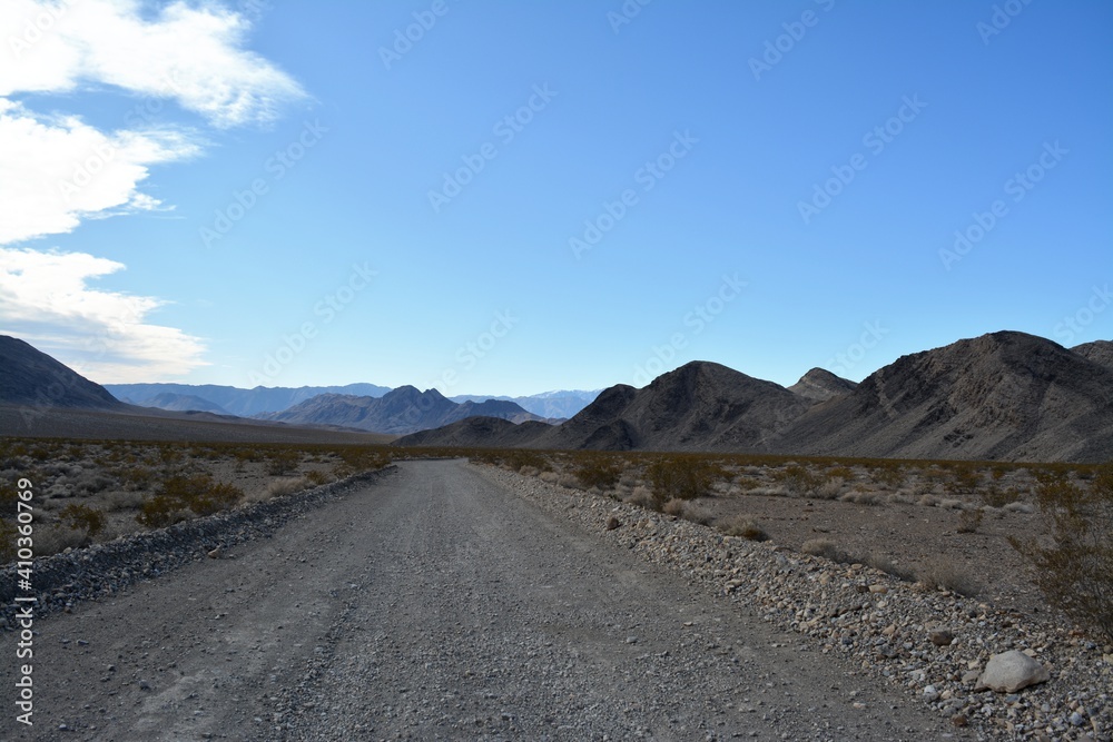 road trip over loose gravel on Racetrack road to the Race Track Playa at the northern end of the Death Valley National Park in December California