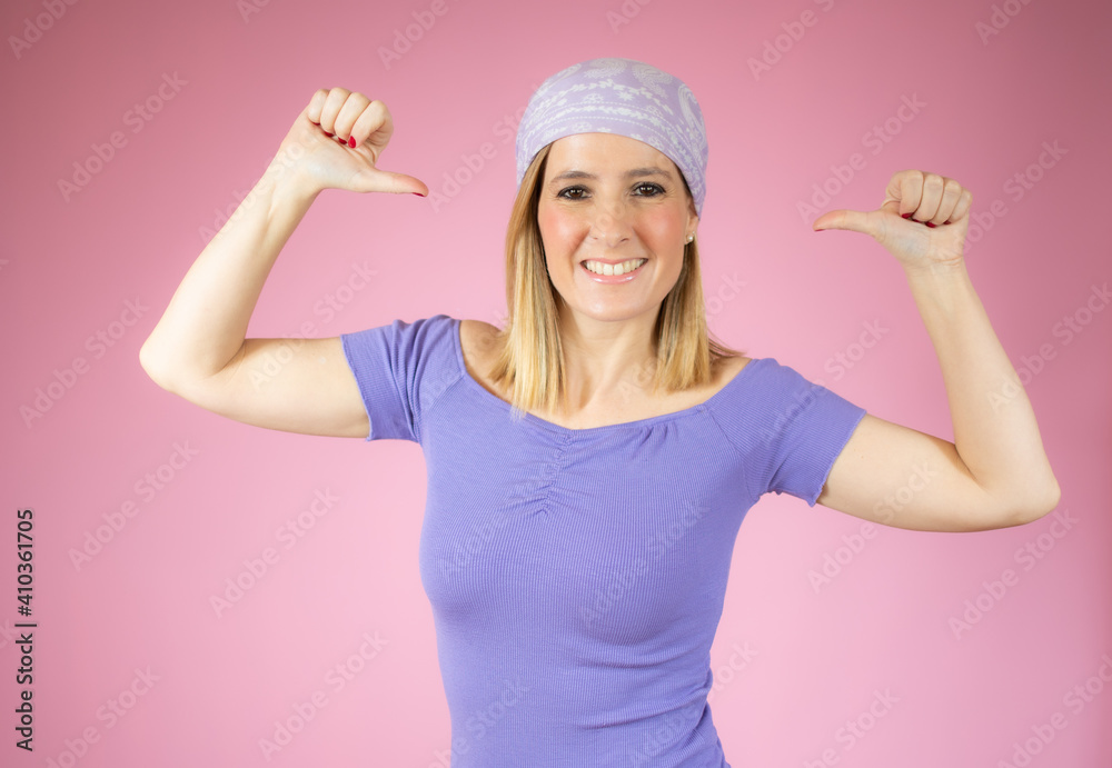 Smiling pretty young woman showing thumbs up isolated over pink background Smiling pretty young woman showing thumbs up isolated over pink background