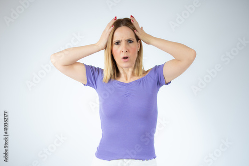 Young beautiful woman has headache isolated over white background