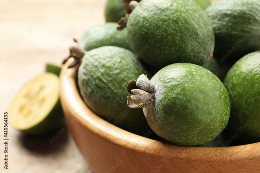 Fresh green feijoa fruits on light table, closeup. Space for text Fresh green feijoa fruits on light table, closeup. Space for text