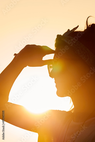 Silhouette of a woman in sunset sunrise time.