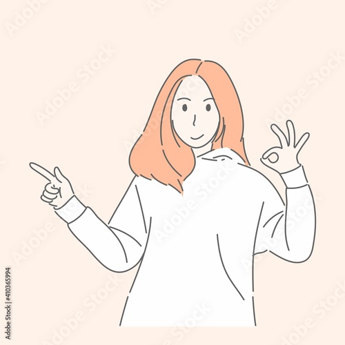 Woman gesturing hand pointing or showing to something for present, adverting concept.