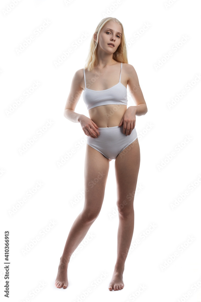 Sexy and sensual blonde woman with perfect body posing in studio isolated over white background with copyspace. Sexy and sensual blonde woman with perfect body posing in studio isolated over white background with copyspace.