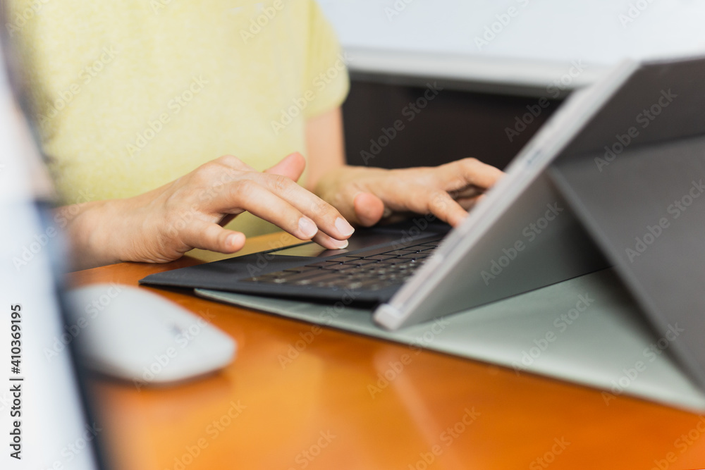 Businesswoman typing on laptop keyboard working from home conceptual. Businesswoman typing on laptop keyboard working from home conceptual.