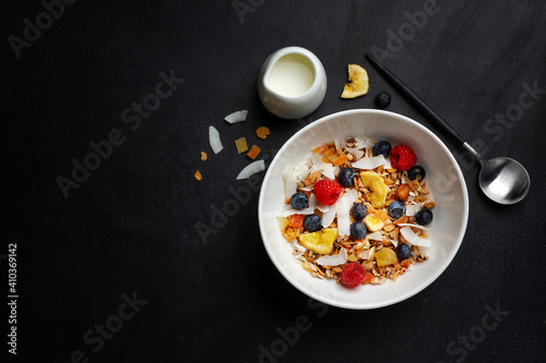 Muesli with berries and fruits in bowl