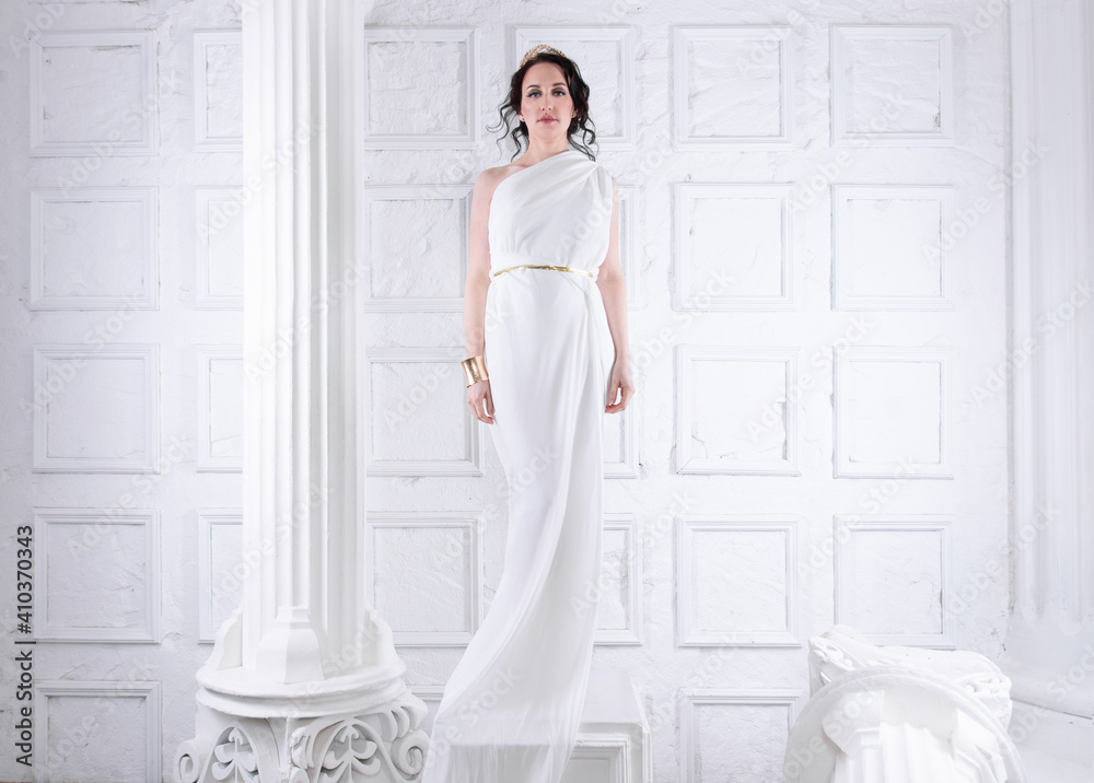 Beautiful Greek goddess woman close up among the white ancient ruins.Greek style woman. Beautiful Greek goddess woman close up among the white ancient ruins.Greek style woman.