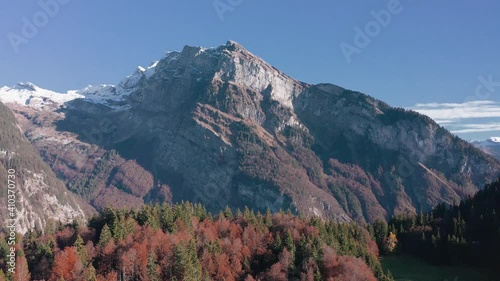 Beautiful rock mountain of La Rosière in France by the forest in autumn -aerial photo