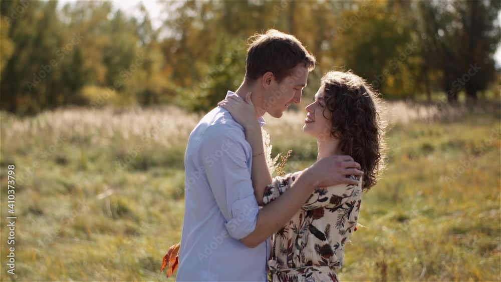 Young Couple in Love Holding Hands Together in Forest. Young Couple in Love Holding Hands Together in Forest.