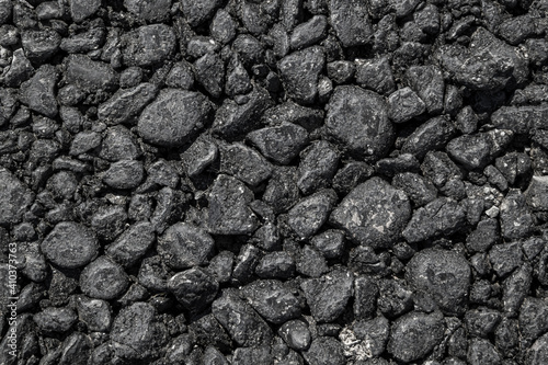 Coarse asphalt as an abstract background.Close-up.