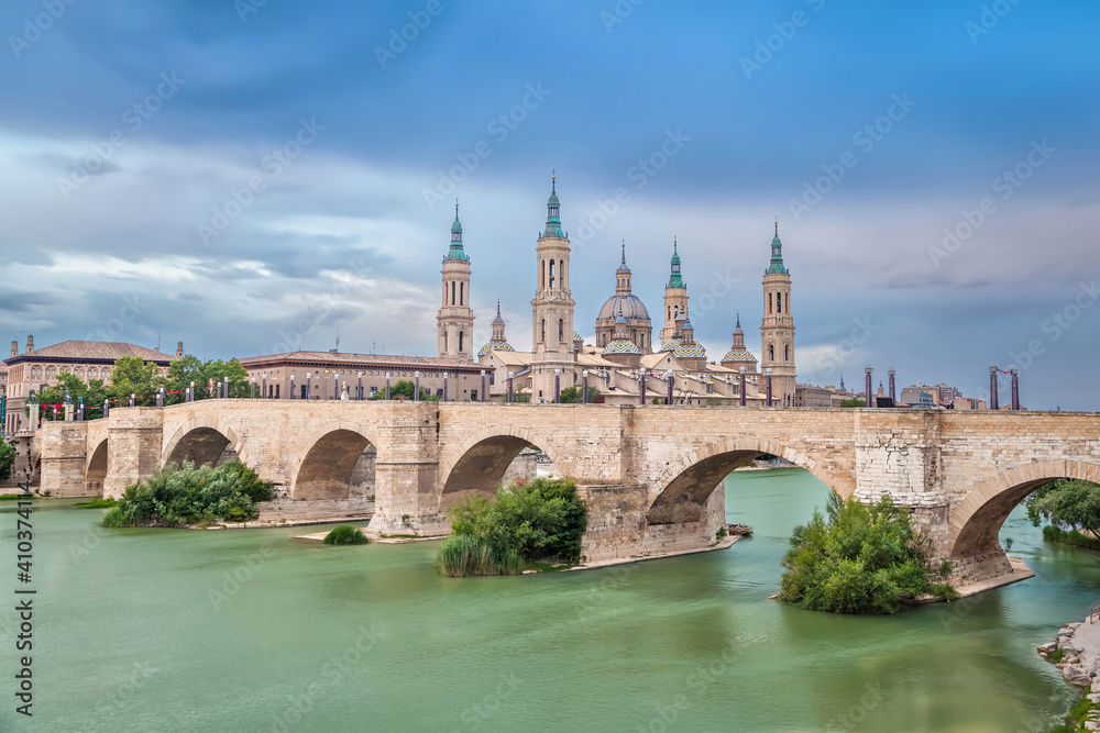 Zaragoza, Spain. View of historic Puente de Piedra bridge. Long exposure shot with HDR effect