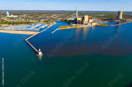 Aerial view of Michigan city East Pierhead lighthouse and the electric power plants in Chicago, Illinois, United States of America. photo