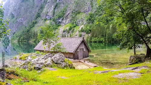 Romantic wooden boathouse at the lake Obersee next to lake Königssee in the Bavarian alps, national park Berchtesgaden, Germany.