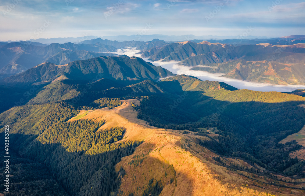 Fototapeta premium Aerial landscape photography. Stunning summer view from flying drone of Sheshul mountain range. Colorful morning view from flying drone of Carpathian mountains.