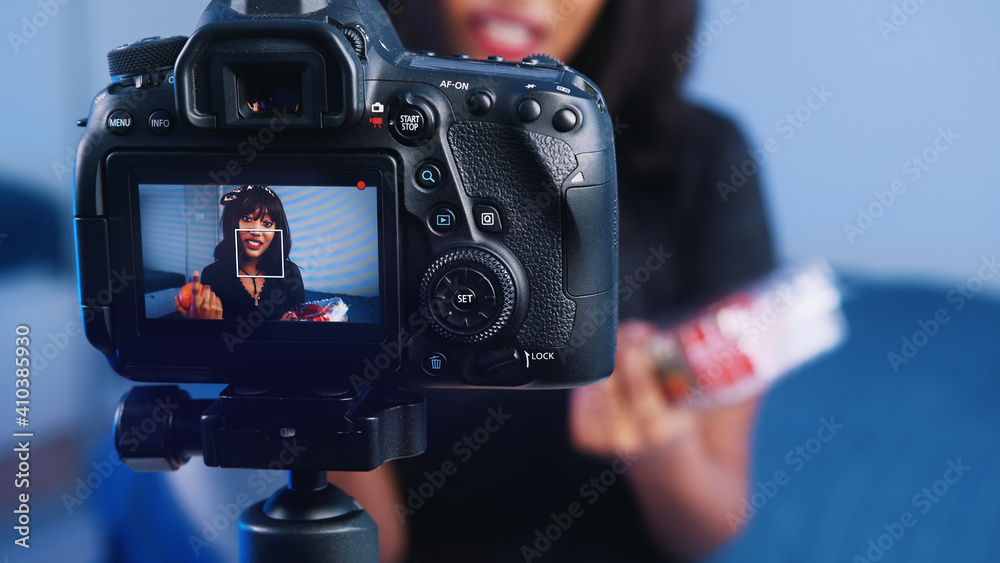 Food blogger young beautiful woman streaming dieting video while holding orange and strawberries. High quality photo Food blogger young beautiful woman streaming dieting video while holding orange and strawberries. High quality photo