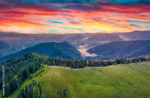Aerial landscape photography. Splendid summer view from flying drone of mountain valley. Stunning sunrise in Carpathian mountains, Ukraine, Europe. Beauty of nature concept background. © Andrew Mayovskyy