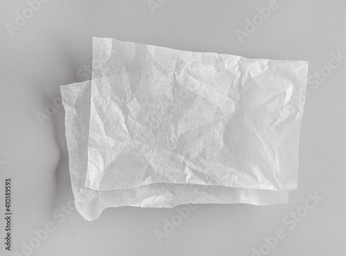 crumpled sheets of white baking paper